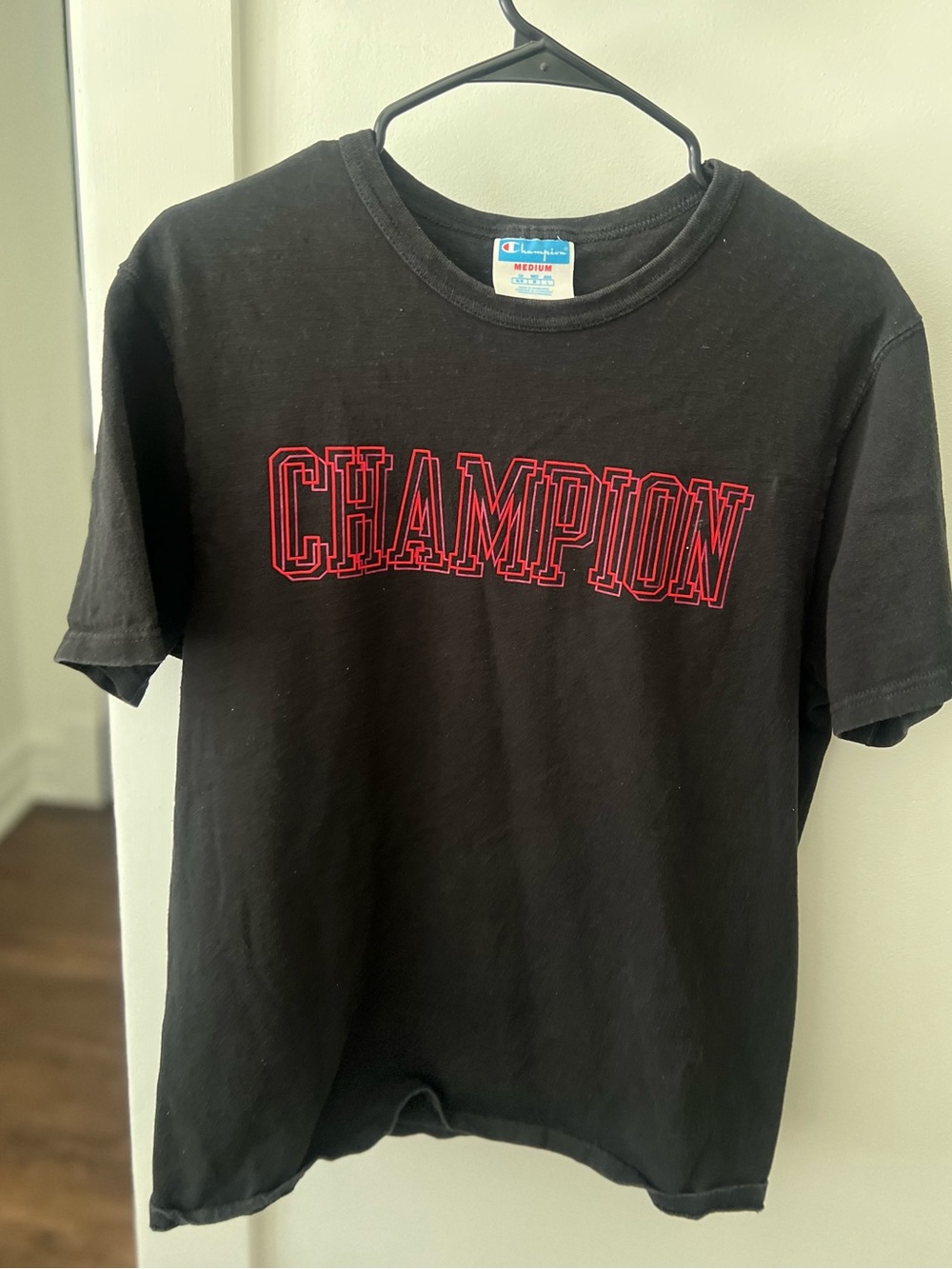 Champion Black Tee with Red Outline Logo